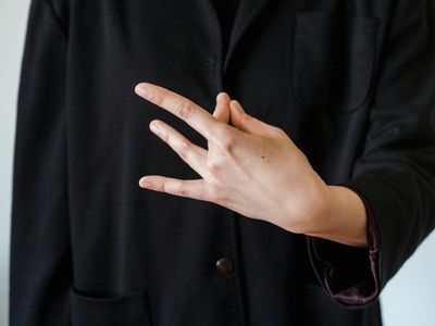 Hands in a mudra position during a meditation session.