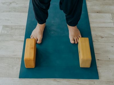 Yoga blocks and accessories arranged neatly in the corner.