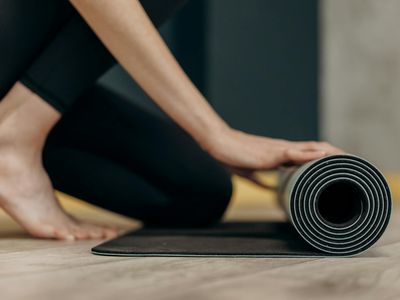Yoga mat and a wooden floor in a calm room.